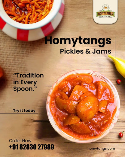Homytangs spicy lemon pickle in a 400g jar, featuring bright yellow lemon slices and red chili flakes.